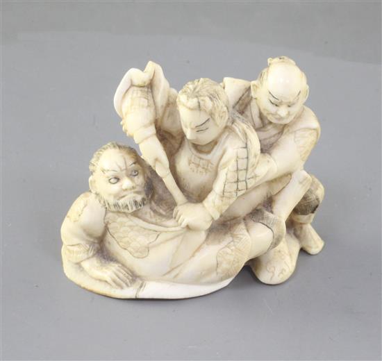 A Japanese ivory okimono netsuke of three Samurai warriors fighting, width 5.6cm